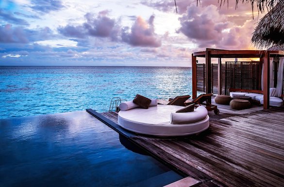 deck and infinity pool overlooking water